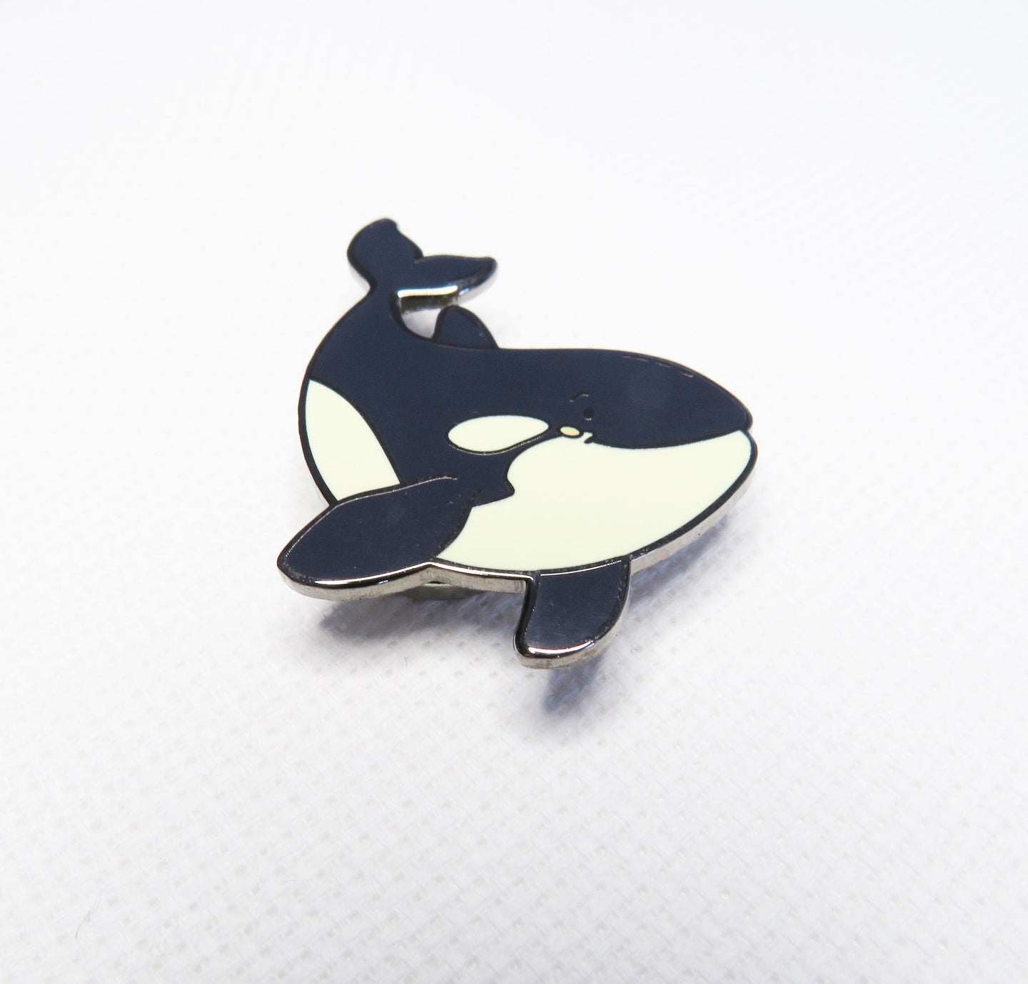 Orca whale needleminder on a background