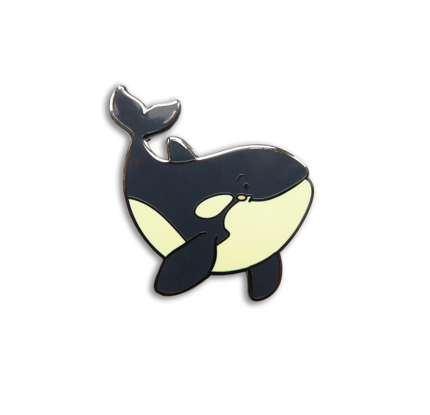 Orca whale-shaped pin on a background