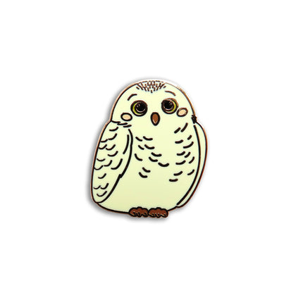 Owl-shaped pin on a white background
