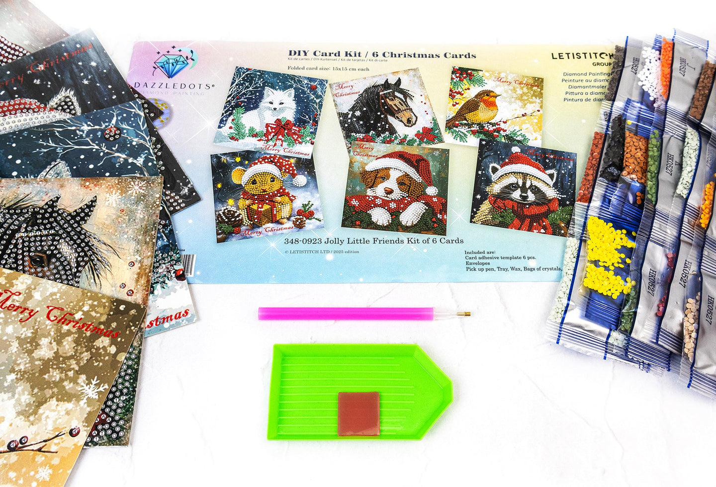 Collection of Christmas-themed cards and craft materials on a white surface