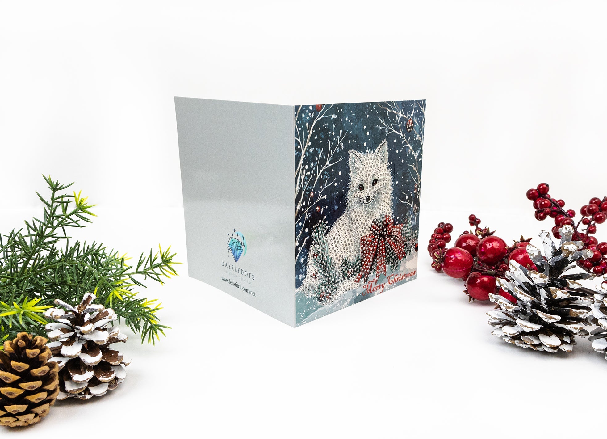Christmas card with a cat design, surrounded by festive decorations on a white background