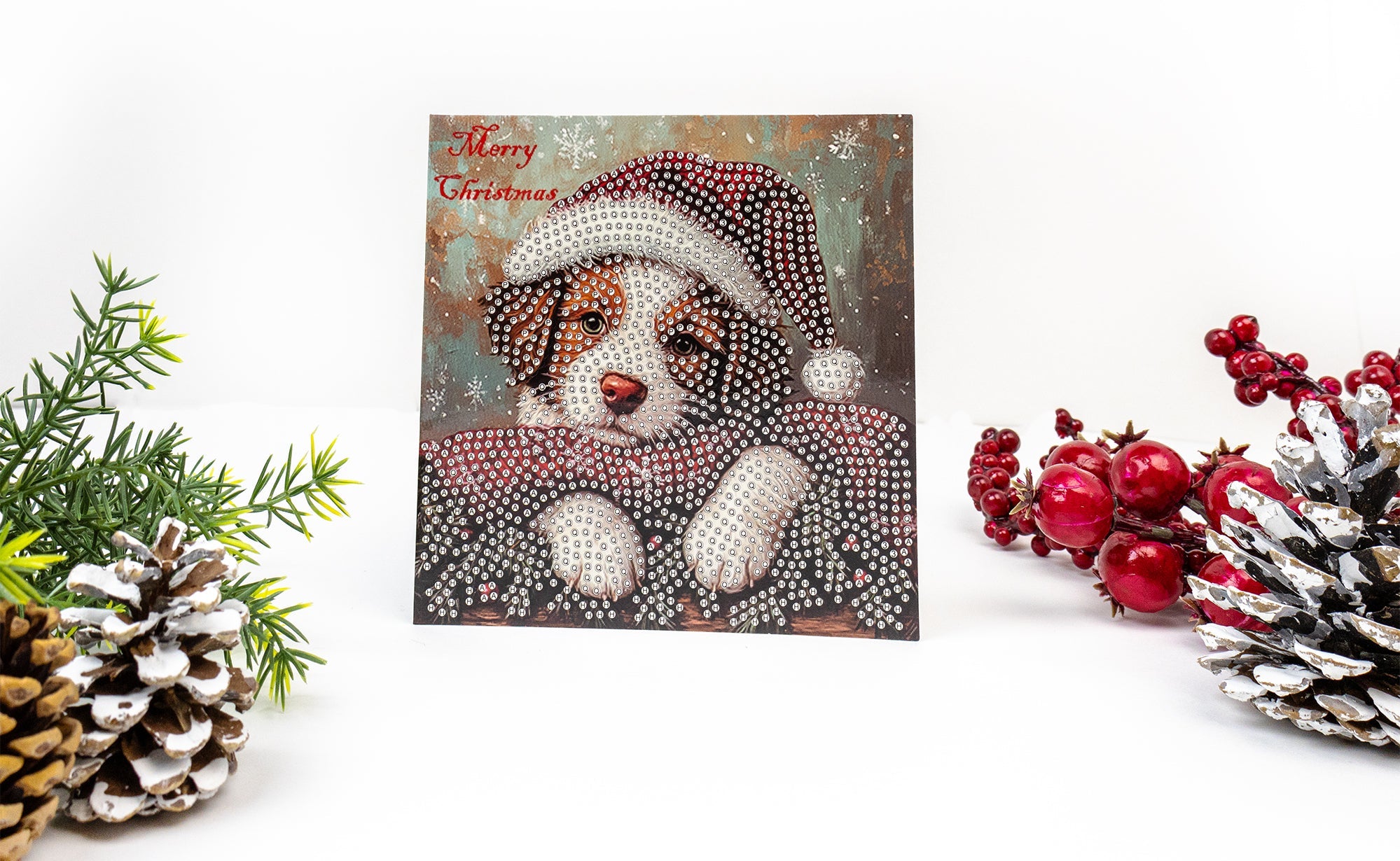 Christmas-themed card with a bear design, surrounded by decorative elements like pine cones and berries.