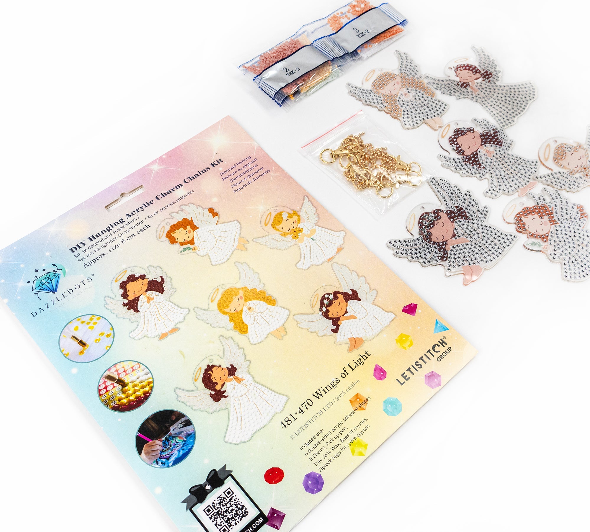 Hanging charm kit with angel designs and gold chain on a white background