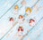 Decorative angel figurines on a light blue wooden surface
