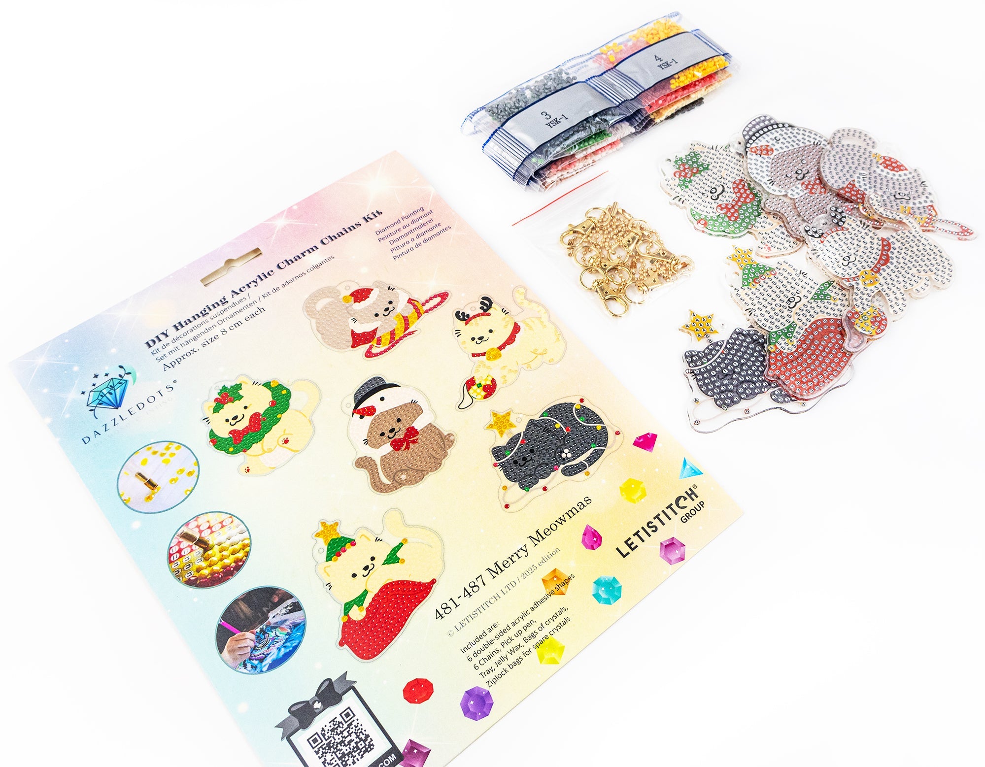 Set of Christmas-themed acrylic charms with packaging on a white background