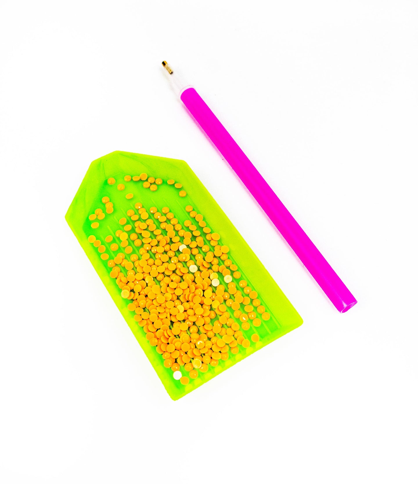 Green pegboard with yellow beads and a pink handle tool on a white background