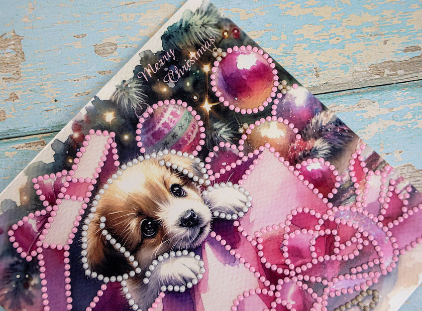 Christmas card with a dog and decorative elements on a wooden surface