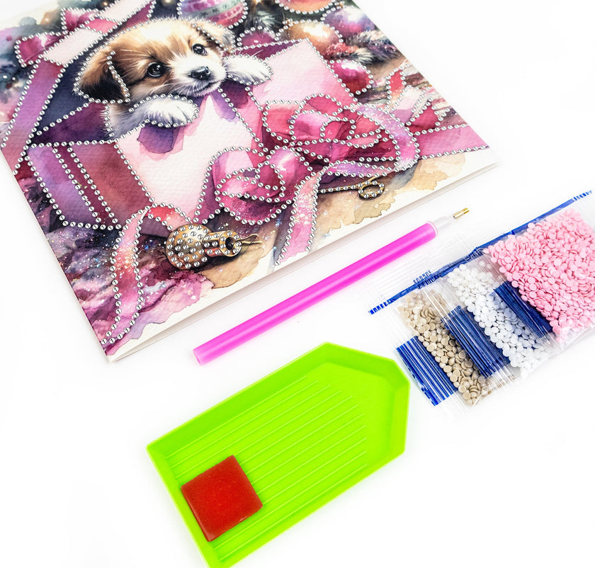 Crafting kit with diamond painting canvas, tools, and beads on a white background