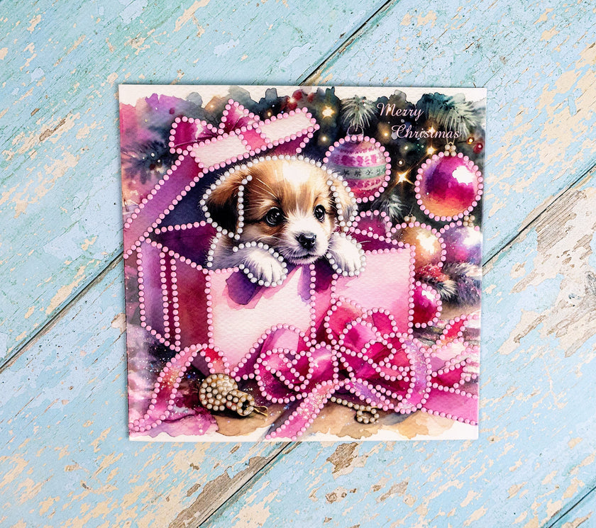 Christmas card with a puppy in a pink outfit on a decorative background