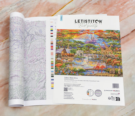 Letistitch cross-stitch kit with a colorful African landscape design on a marble surface