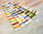 Color swatch card with embroidery threads on a marble surface