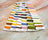 Color swatch card with various threads on a marble surface