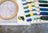 Embroidery hoop and color swatch with embroidery threads on a textured surface