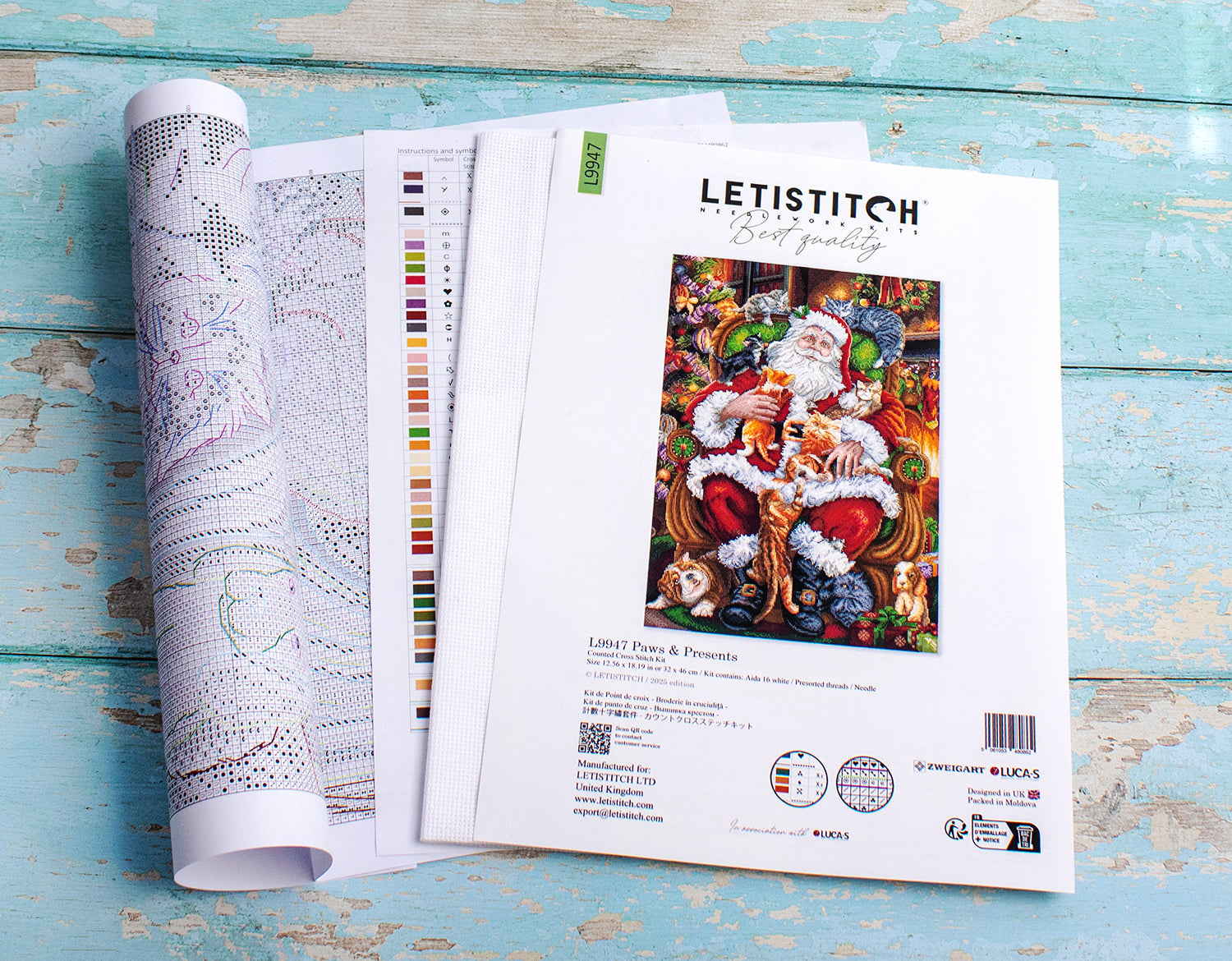 Letistitch cross stitch kit with pattern paper and color chart on a wooden surface