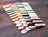 Set of colorful thread samples on a wooden surface