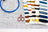 Embroidery hoop, scissors, and color swatch on a cross-stitch chart