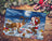 Decorative Christmas scene with Santa Claus, reindeer, and gifts on a wooden surface.
