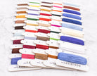 Collection of colorful embroidery threads on white cards with 'LELETISTITCH' branding.