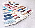 Color swatch card with various embroidery threads from LETISTITCH on a light gray background
