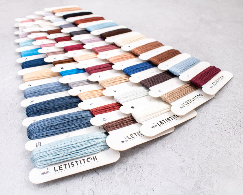 Color swatch card with various embroidery threads from LETISTITCH on a light gray background