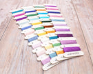 Set of colorful embroidery threads on wooden cards with 'Letistitch' branding.