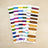 Set of colorful thread spools on a beige background