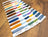 Set of embroidery floss colors on a wooden surface