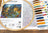 Embroidery hoop with cross-stitch pattern and color chart on a wooden surface