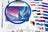 Embroidery hoop with a colorful design of a wolf and mountains, surrounded by spools of thread.