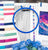 Embroidery hoop with cross-stitch pattern and fabric swatches on a table
