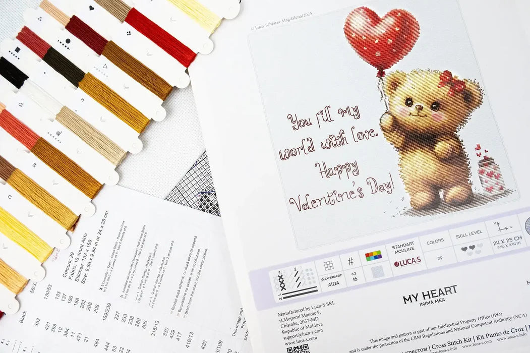 Valentine's Day card with a teddy bear and heart balloon, surrounded by color swatches and printed materials.