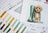 Cross-stitch kit with a dog illustration and color swatches on a white background