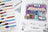 Color swatch book and illustration of a ice cream shop with 'La Dolce Scoop' branding.