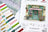Cross stitch kit with pattern chart, thread colors, and packaging featuring 'The Little Gift Shop'.