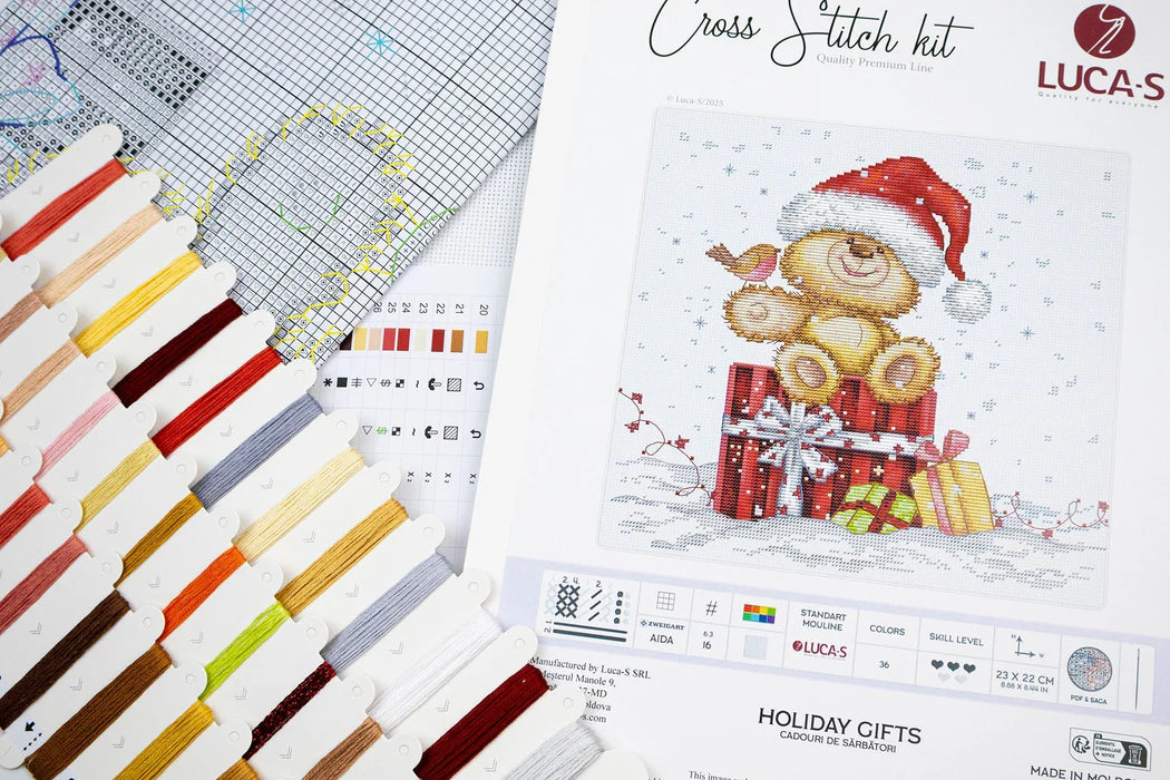Cross stitch kit with a Christmas-themed design and color chart.