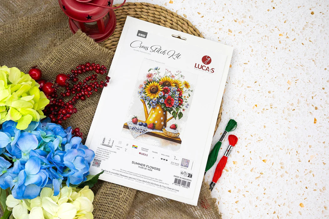 Lucas Cross Stitch Kit packaging with floral design on a textured surface