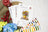 Color swatch book, floral design paper, and floral decorations on a textured surface