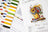 Cross stitch kit with color chart and design of a sunflower and flowers.