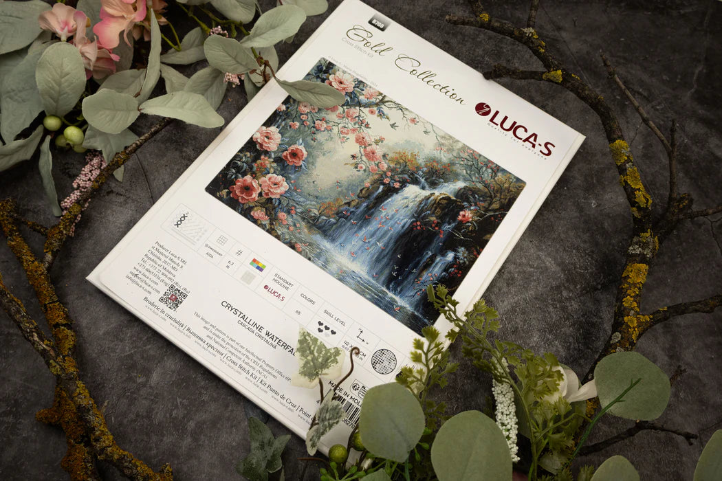 Floral painting on a 'Lucas' brand package with decorative greenery around.