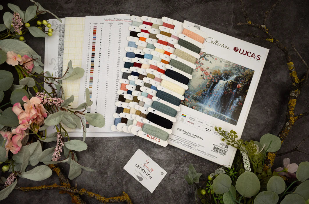 Color swatches and design samples on a dark surface with floral and greenery accents