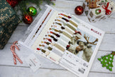 Lucas color swatch book with Christmas-themed decorations on a wooden surface
