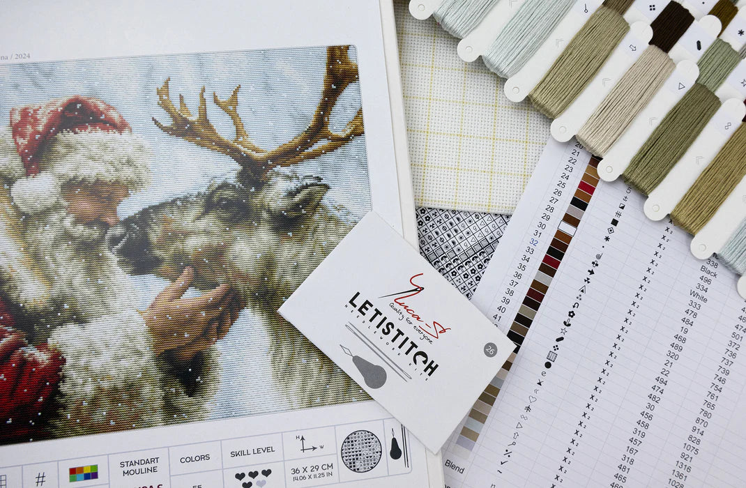 Cross-stitch pattern with Santa and reindeer design, color swatches, and Letistitch branding.