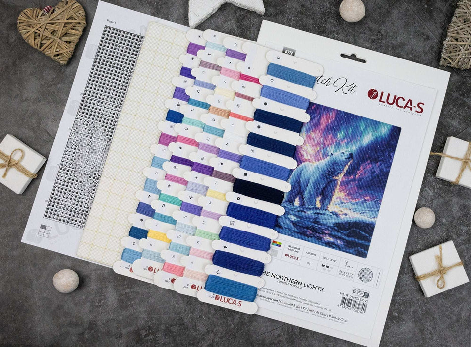 Packaging of Luca-S embroidery thread set with a polar bear design on a textured surface.
