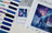 Cross stitch kit with pattern and color swatch on a textured surface