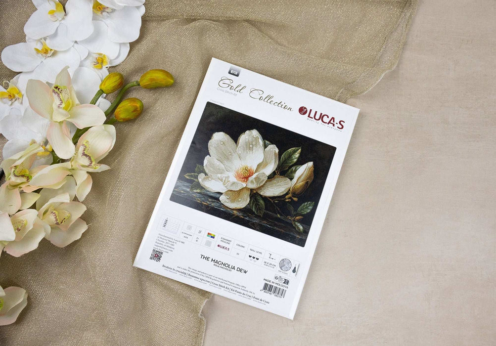 Lucas cross-stitch kit with a magnolia design on a beige fabric background