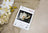 Lucas cross-stitch kit with a magnolia design on a beige fabric background