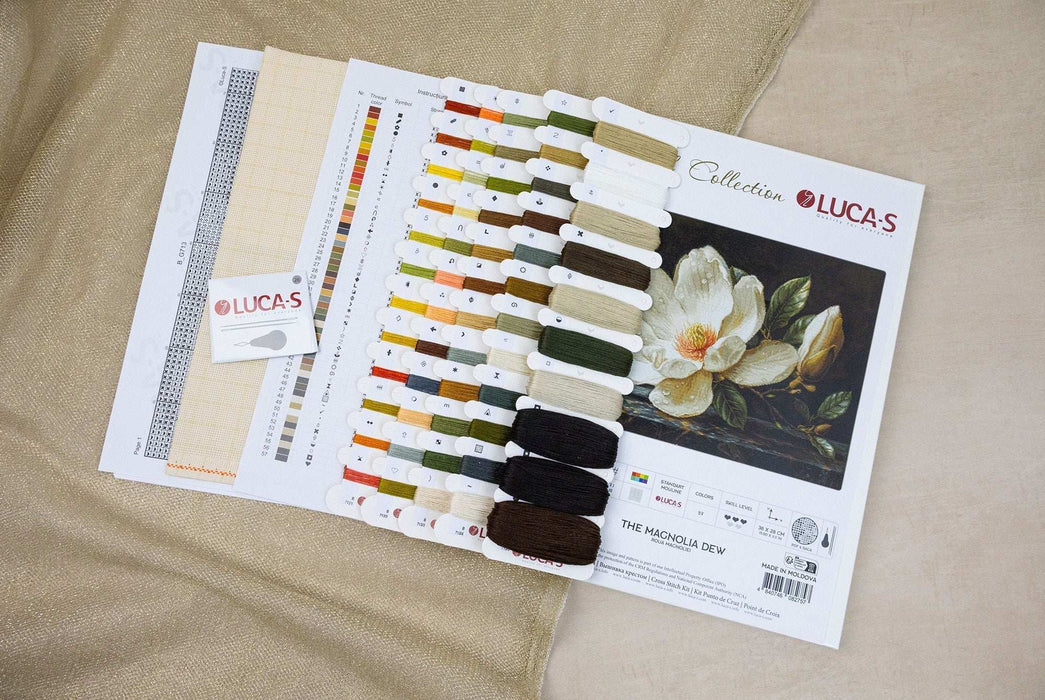 Color swatch book with paint samples and a flower illustration on a beige fabric background