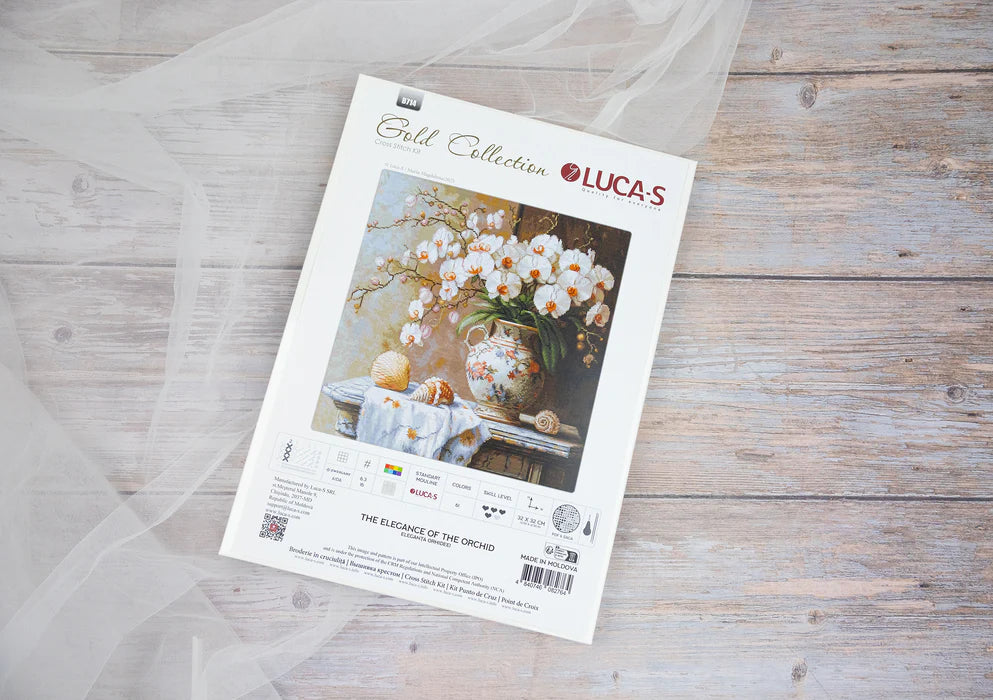 Lucas Gold Collection cross-stitch kit on a wooden surface