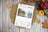 Lucas Gold Collection cross-stitch kit on a wooden surface with fall decorations