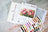 Lucas embroidery kit with color chart and thread packets on a marble surface